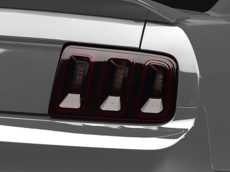 
                      
                        Raxiom 05-09 Ford Mustang Gen5 Tail Lights- Black Housing (Smoked Lens)
                      
                    